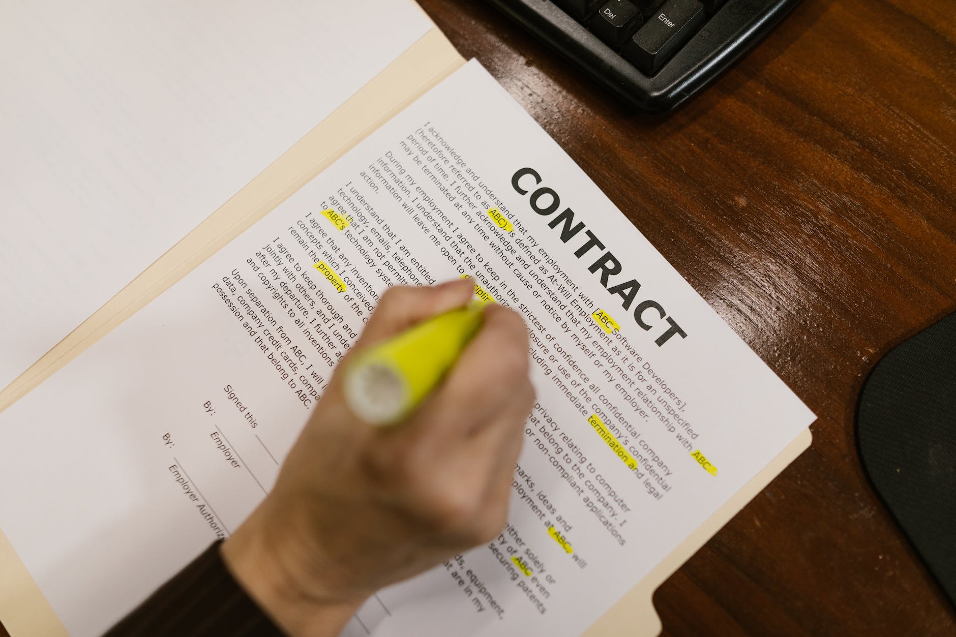 close up shot of a person holding a contract